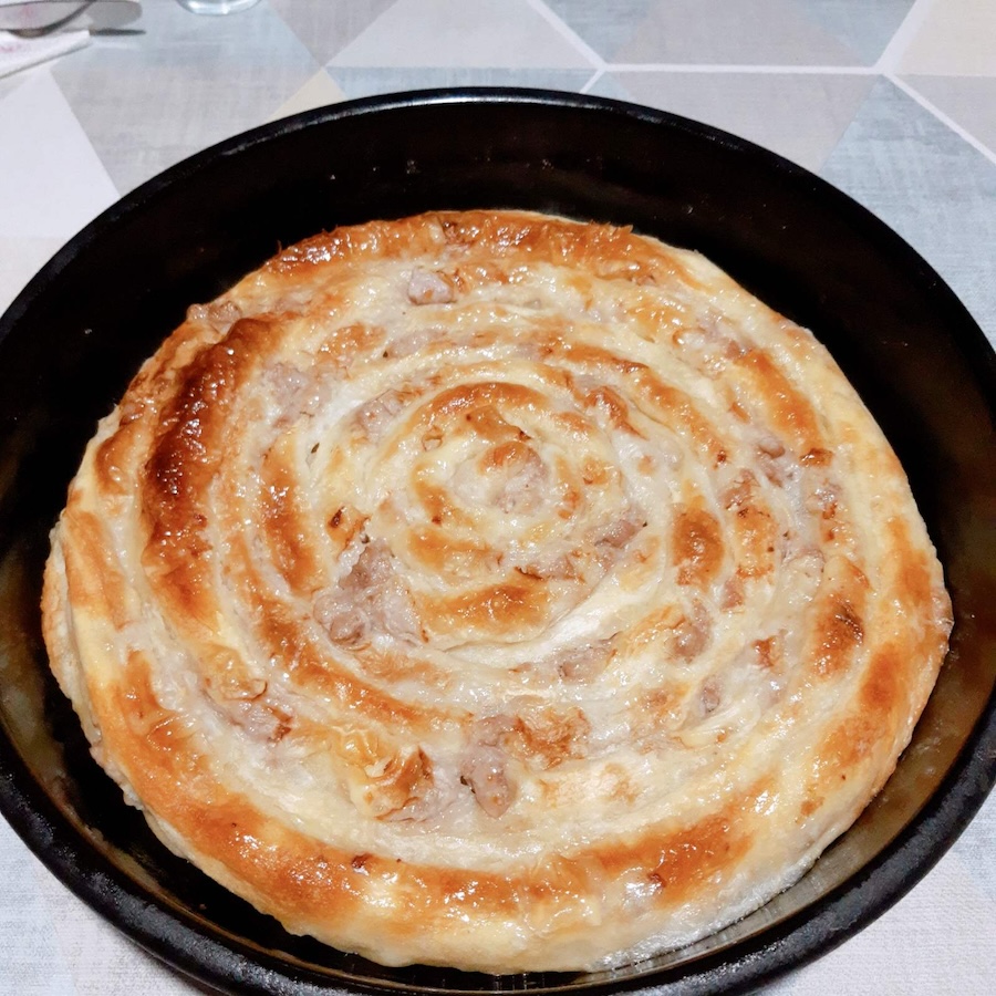 Burek with chopped meat after baking