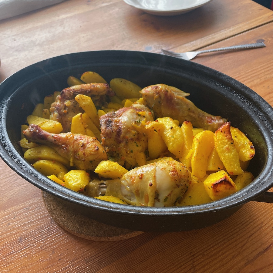 Chicken with potatoes in baking tray